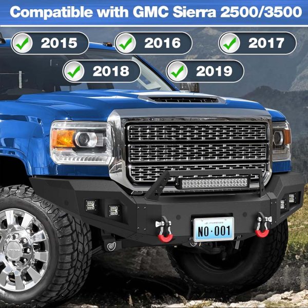 GMC Sierra HD with steel bumper driving on rugged off-road trail